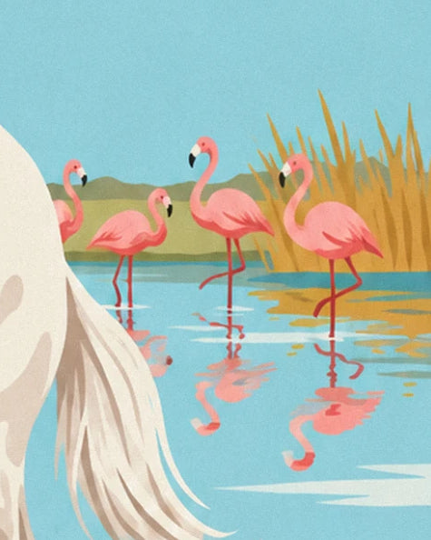 The 4 pink flamingos in the calm water in front of the golden reeds
