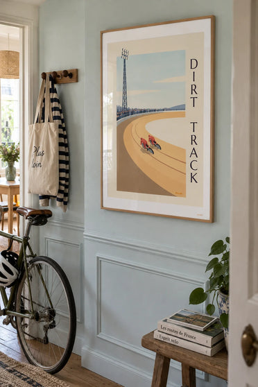 Poster of a speedway race on a dirt track: framed on a wall