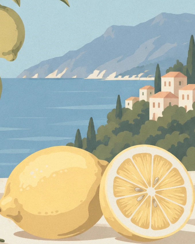 A whole lemon and a lemon half in front of the bay, its cypress trees and houses with pink roofs