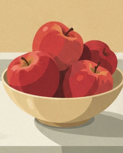The red apples with golden highlights in a cream-coloured bowl
