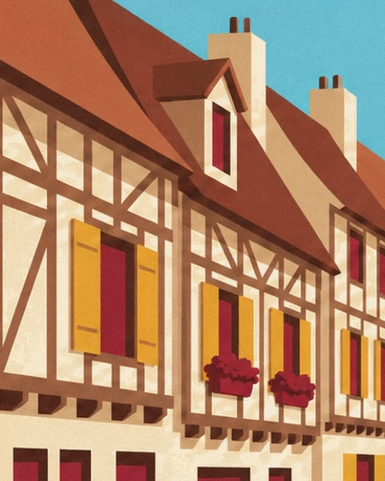 Les maisons à colombages aux volets jaunes et aux jardinières rouges sous les toits pentus