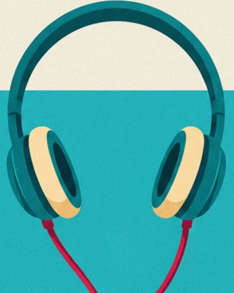 The teal headphones with cream ear cushions and pink wires against a turquoise background