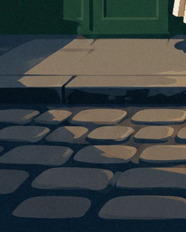 The rounded cobbles and pavement kerb in front of the bistro's green façade