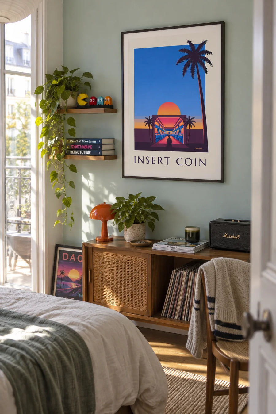 Poster of an arcade hall, neon lights and setting sun: framed on the wall