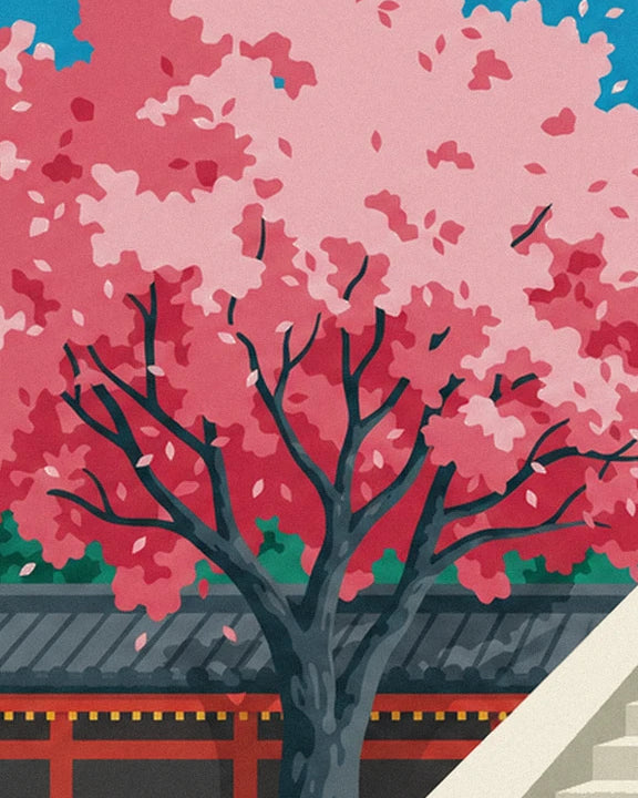 The cherry tree with dark branches and pink blossom in front of the temple’s grey roof