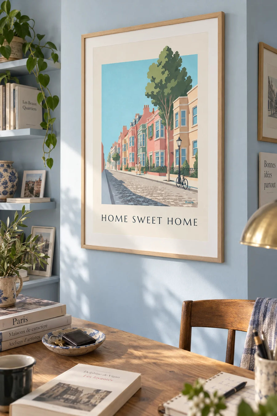 Poster of a street of colorful townhouses and small front gardens: framed on the wall