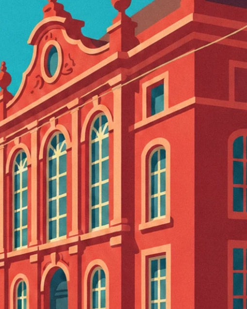 The red façade of the town hall, its tall windows and scroll-topped pediment