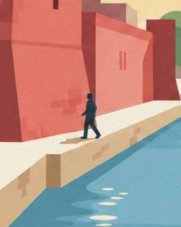 A person walking along the quay beside the Basse, between red façades and blue water
