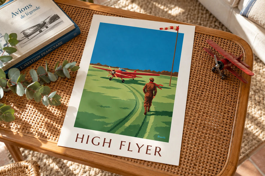 Affiche aviatrice et avion à hélice rouge sur une piste en herbe : posée sur une table