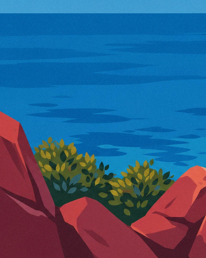 Das tiefblaue Meer, gesehen von den roten Felsen, mit 2 Büscheln grüner Sträucher