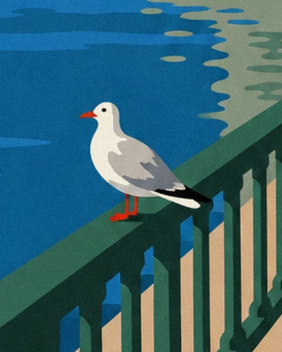 A seagull with a red beak and grey wings perched on the green railing