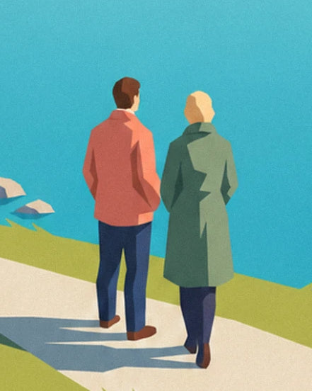 A couple seen from behind, in a coral jacket and green coat, walking along the lakeside path