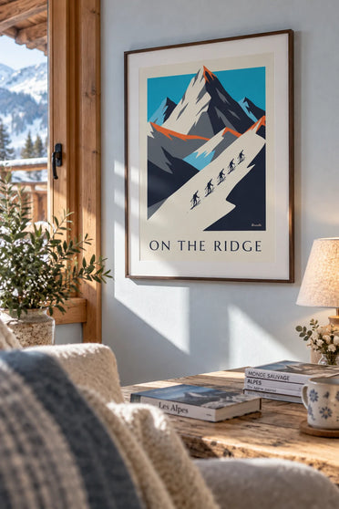 Poster of silhouetted skiers in a line along a snowy ridge: framed on the wall
