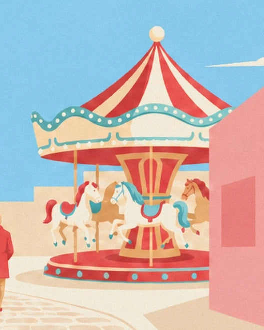 The carousel with white and brown horses beneath its red and cream canopy