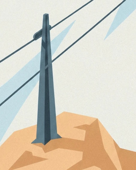 The dark cable car pylon and its cables above ochre rocks