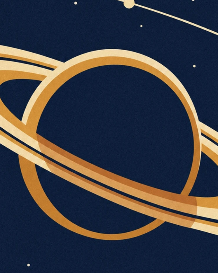 Saturn's broad golden rings against a starry midnight blue background