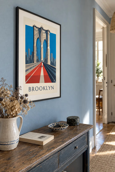 Poster of the Brooklyn Bridge in perspective from its walkway: framed on the wall
