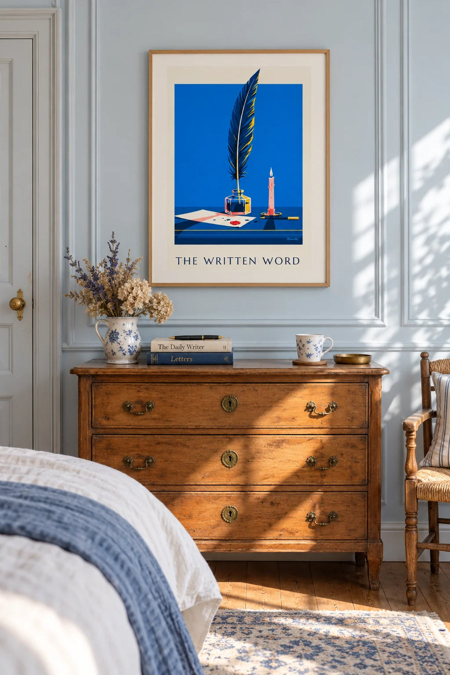 Poster of a quill and inkwell on a writing desk: framed on the wall
