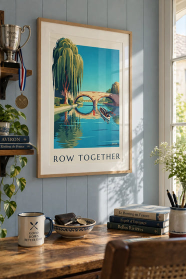 Poster of rowers on a willow-lined river: framed on the wall