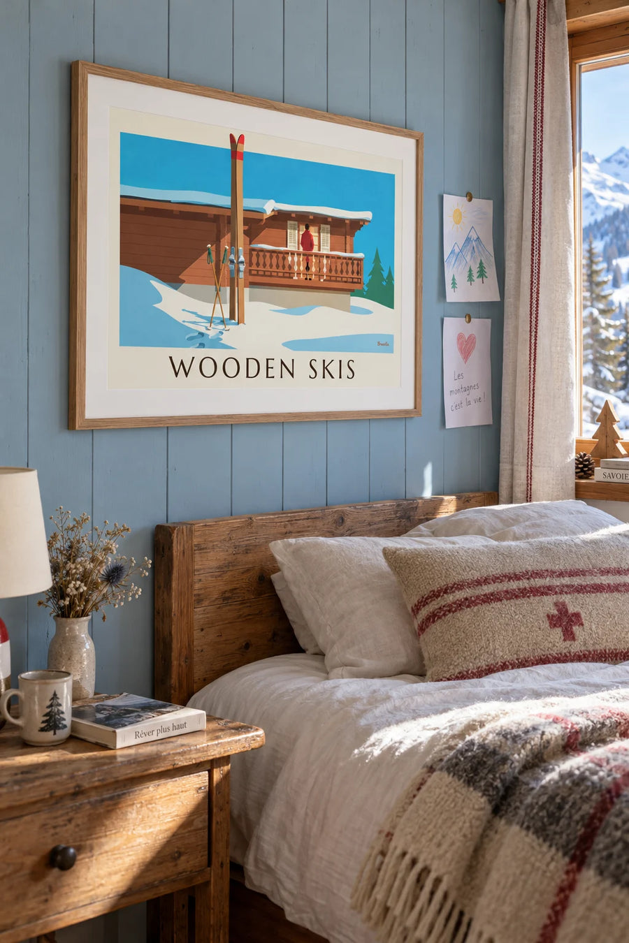 Poster of wooden skis and poles against a snowy chalet: framed on the wall